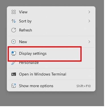Right click on the desktop and select "Display Settings" from the shortcut menu.
